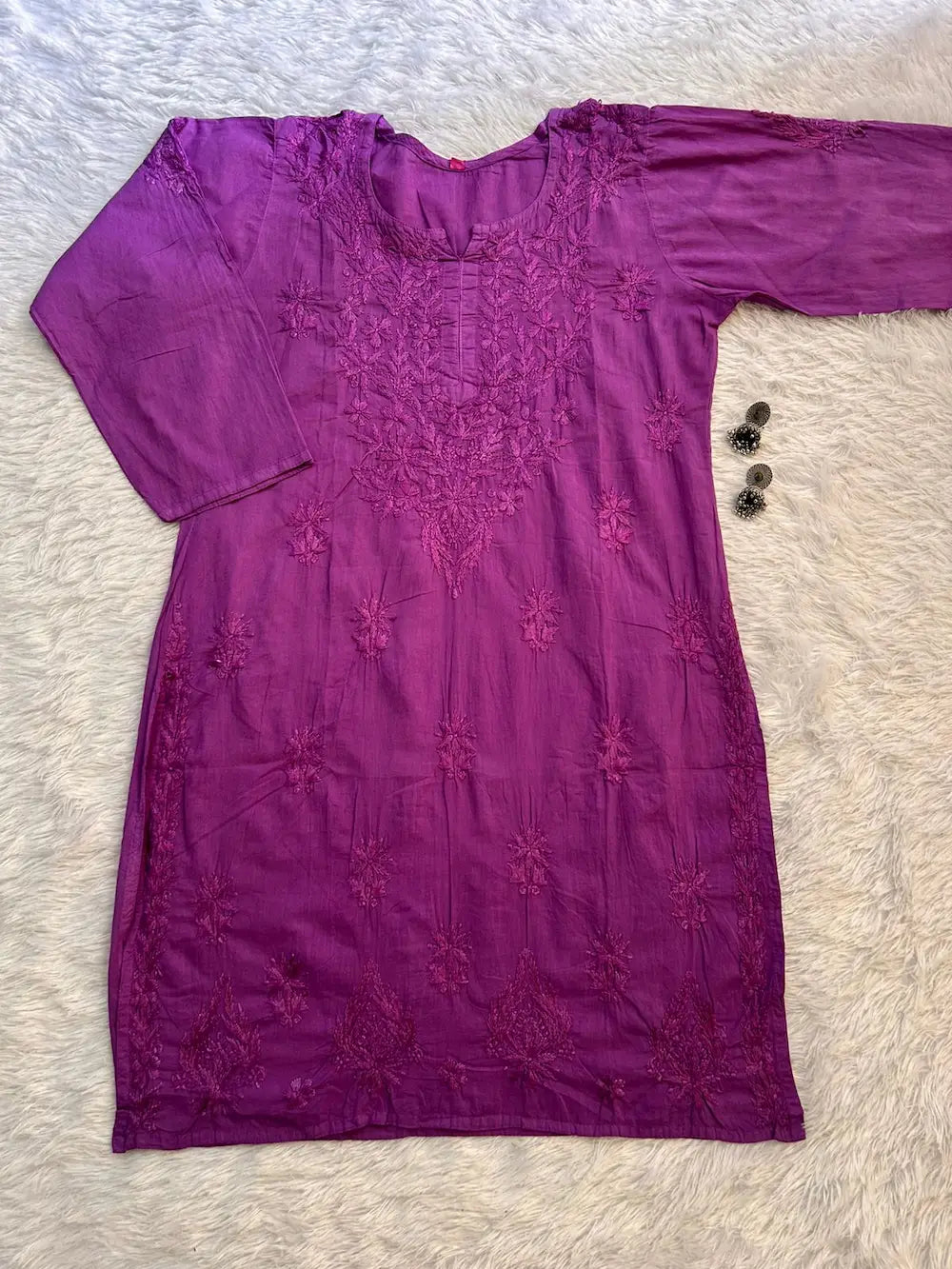 Purple dress with intricate embroidery of chikankari