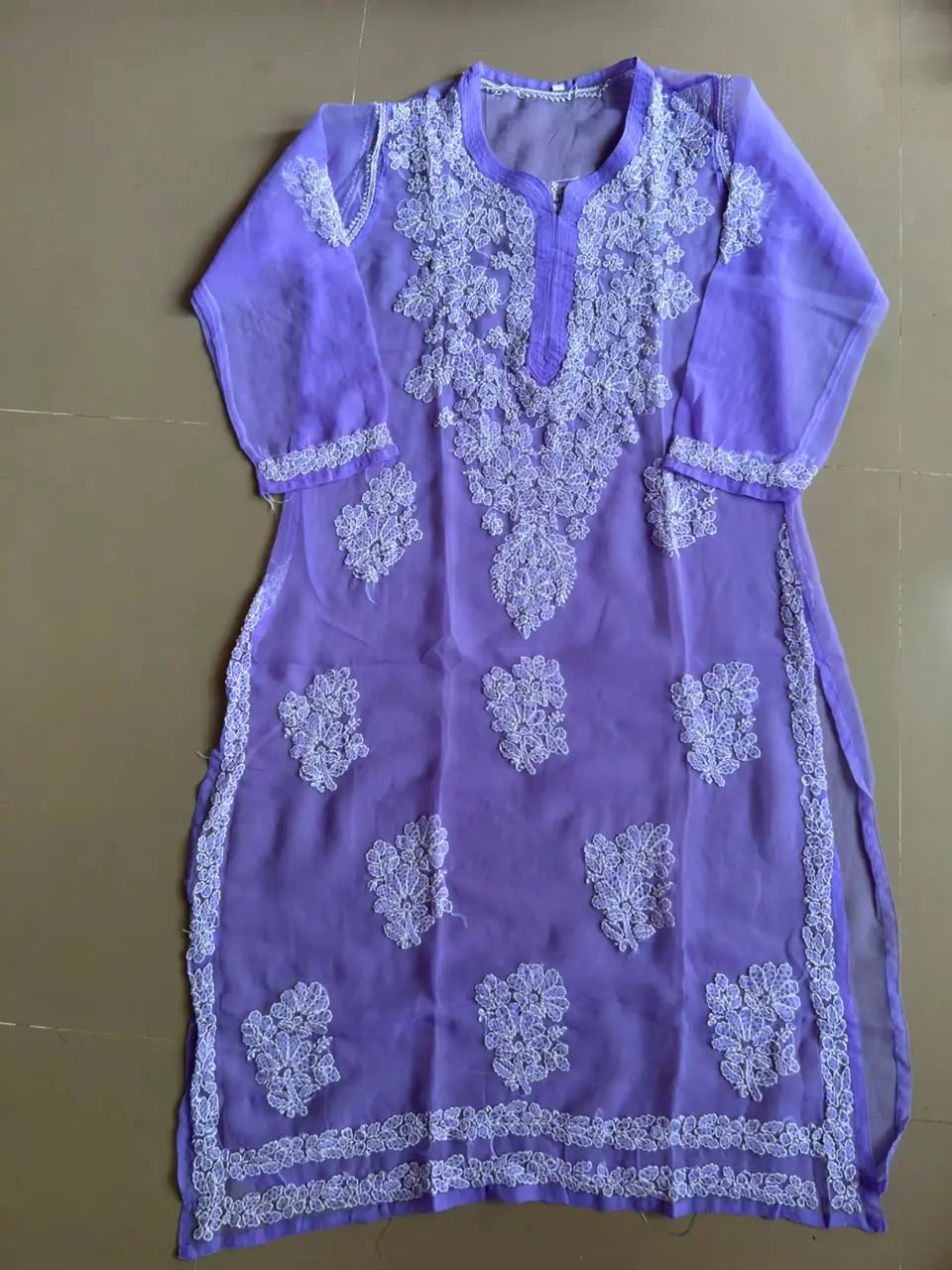Ayena Lavender Georgette Chikankari Kurti featuring intricate hand embroidery on lightweight georgette fabric for an elegant festive and ethnic look by Hayat’s Lucknowi.
