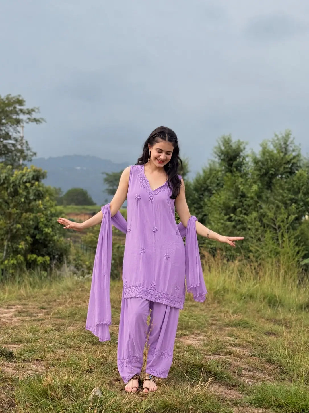 Lavender sleeveless rayon Chikankari Farshi set featuring intricate handcrafted Chikankari embroidery on soft, flowy rayon fabric with a graceful traditional Farshi silhouette for elegant festive and ethnic wear by Hayat's Lucknowi.
