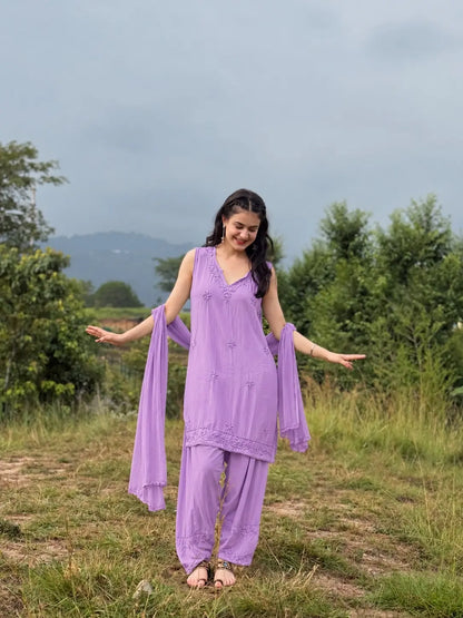 Lavender sleeveless rayon Chikankari Farshi set featuring intricate handcrafted Chikankari embroidery on soft, flowy rayon fabric with a graceful traditional Farshi silhouette for elegant festive and ethnic wear by Hayat's Lucknowi.

