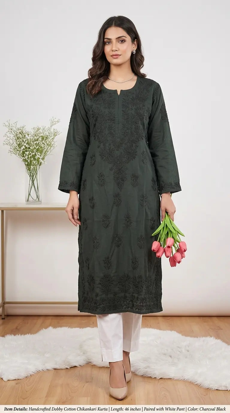 
Liyana black dobby cotton Lucknowi chikankari kurta featuring delicate hand embroidery and textured breathable fabric for elegant everyday ethnic wear by Hayat's Lucknowi.
