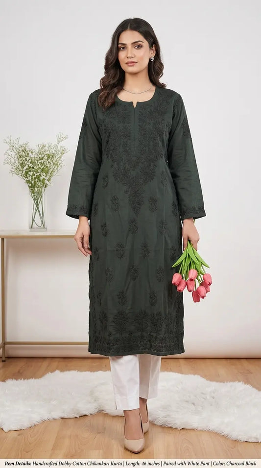 
Liyana black dobby cotton Lucknowi chikankari kurta featuring delicate hand embroidery and textured breathable fabric for elegant everyday ethnic wear by Hayat's Lucknowi.
