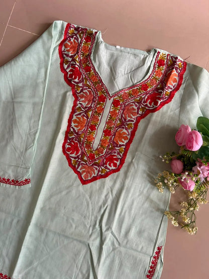 
Mint green cotton Kashmiri short embroidered kurti featuring intricate traditional Kashmiri embroidery and soft breathable cotton fabric for fresh and elegant everyday ethnic wear by Hayat's Lucknowi.
