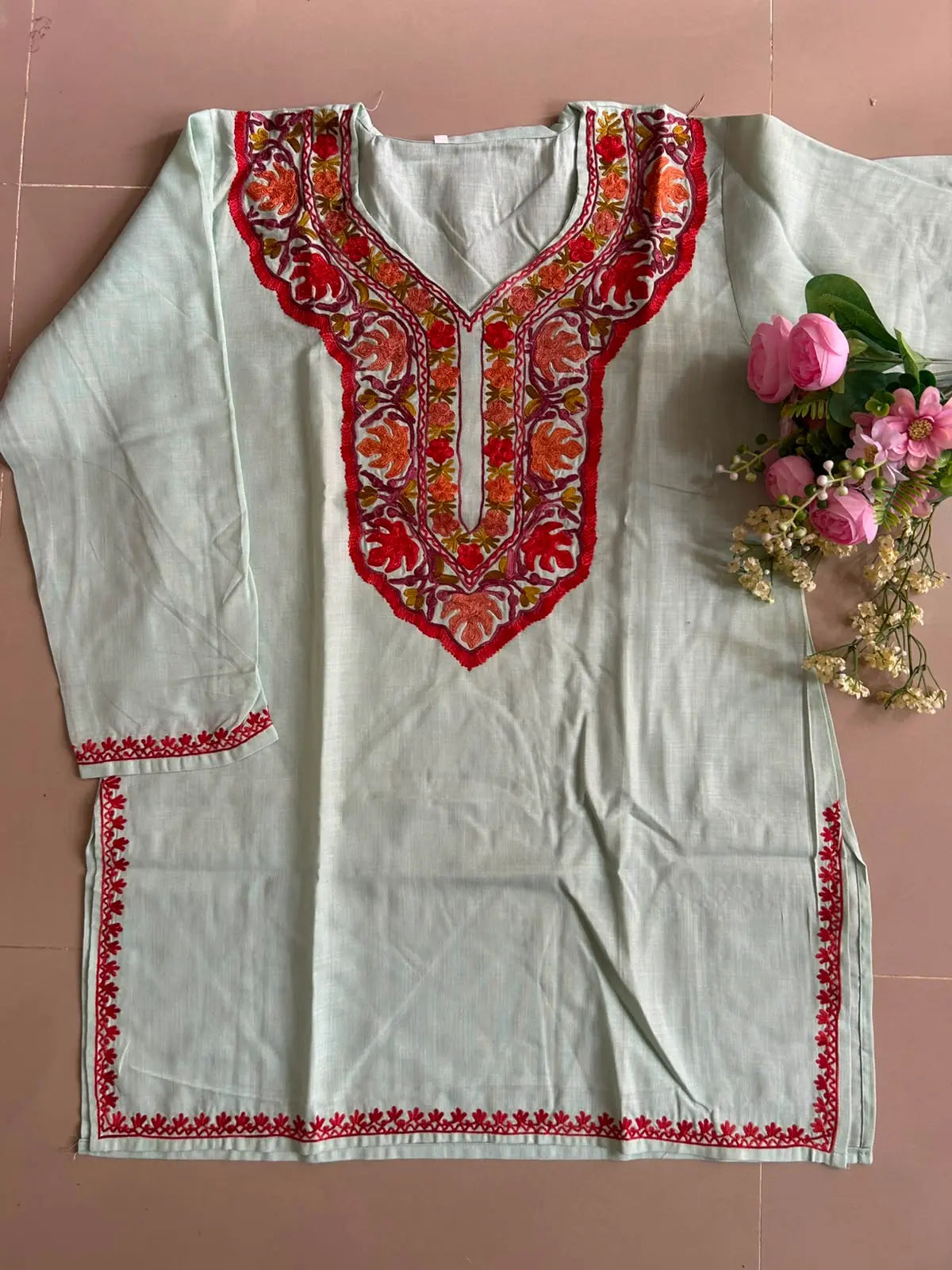 
Mint green cotton Kashmiri short embroidered kurti featuring intricate traditional Kashmiri embroidery and soft breathable cotton fabric for fresh and elegant everyday ethnic wear by Hayat's Lucknowi.
