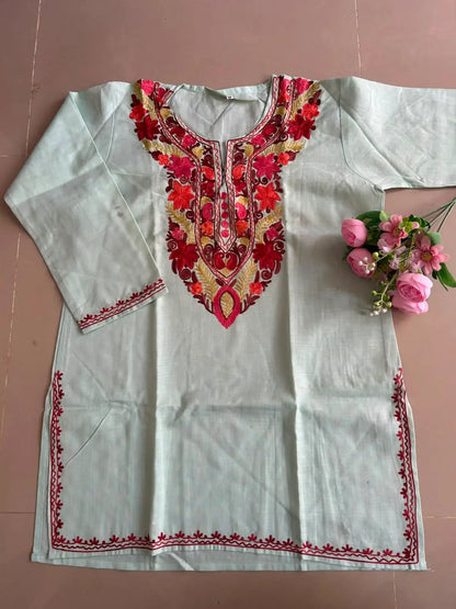
Mint-pista cotton Kashmiri short embroidered kurti featuring intricate traditional Kashmiri embroidery and soft breathable cotton fabric for fresh and elegant everyday ethnic wear by Hayat's Lucknowi.
