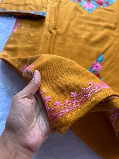 
Mustard Kashmiri woolen pheran co-ord set crafted for traditional winter styling by Hayat's Lucknowi
