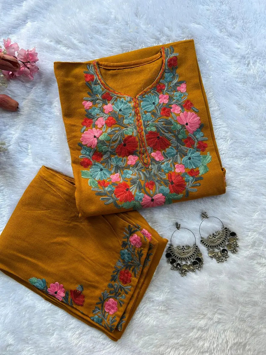 
Mustard Kashmiri woolen pheran co-ord set crafted for traditional winter styling by Hayat's Lucknowi
