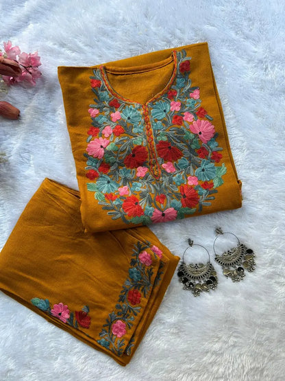 
Mustard Kashmiri woolen pheran co-ord set crafted for traditional winter styling by Hayat's Lucknowi
