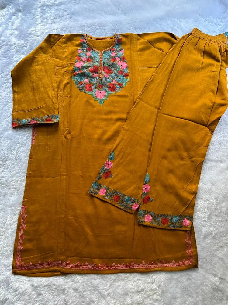 
Mustard Kashmiri woolen pheran co-ord set crafted for traditional winter styling by Hayat's Lucknowi
