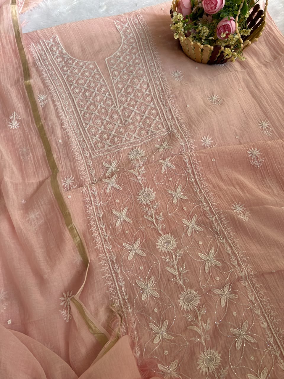 
Naaz women's pink mul Chanderi handwork kurta and dupatta unstitched suit featuring intricate handcrafted detailing and elegant traditional styling for festive ethnic wear by Hayat's Lucknowi
