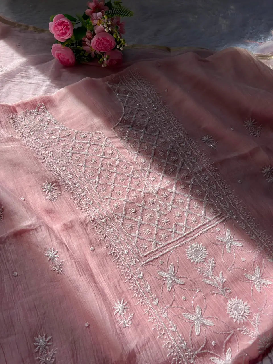 
Naaz women's pink mul Chanderi handwork kurta and dupatta unstitched suit featuring intricate handcrafted detailing and elegant traditional styling for festive ethnic wear by Hayat's Lucknowi
