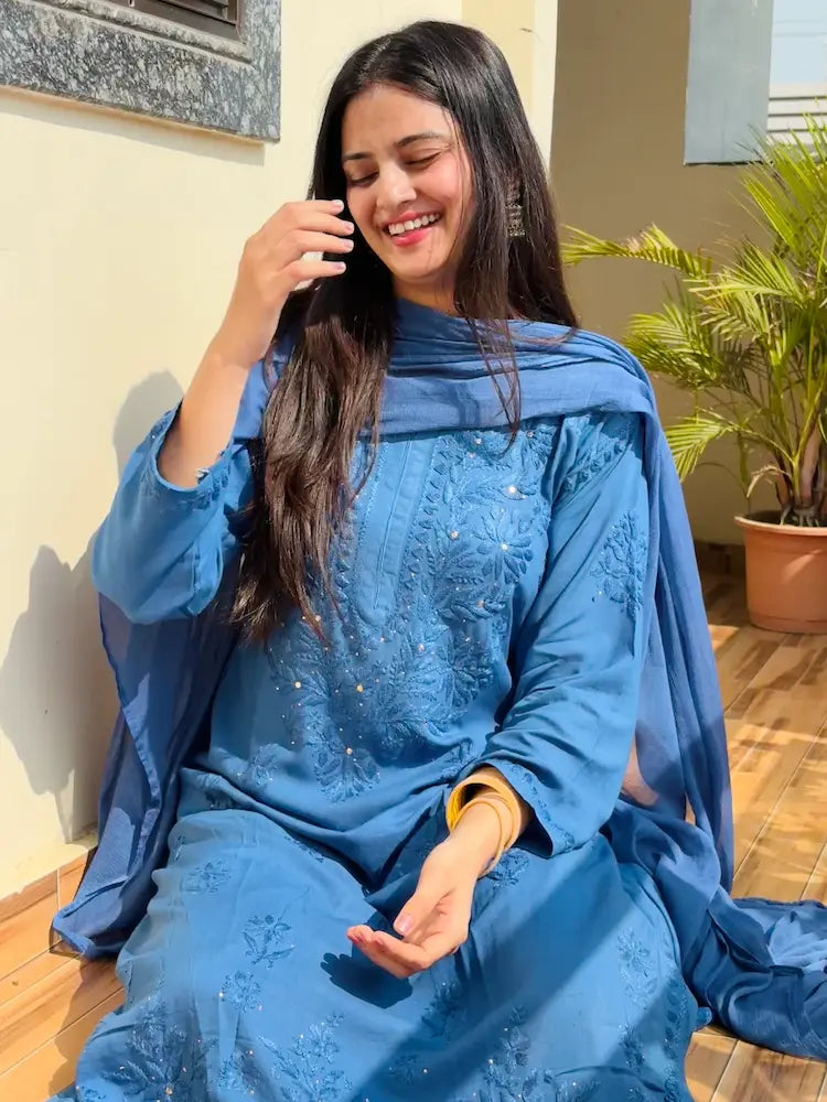 
Nagma blue rayon Lucknowi Mukesh Chikankari set with dupatta featuring exquisite handcrafted Chikankari embroidery enhanced with elegant Mukesh work on soft breathable rayon fabric for festive, party, and graceful ethnic wear by Hayat's Lucknowi.
