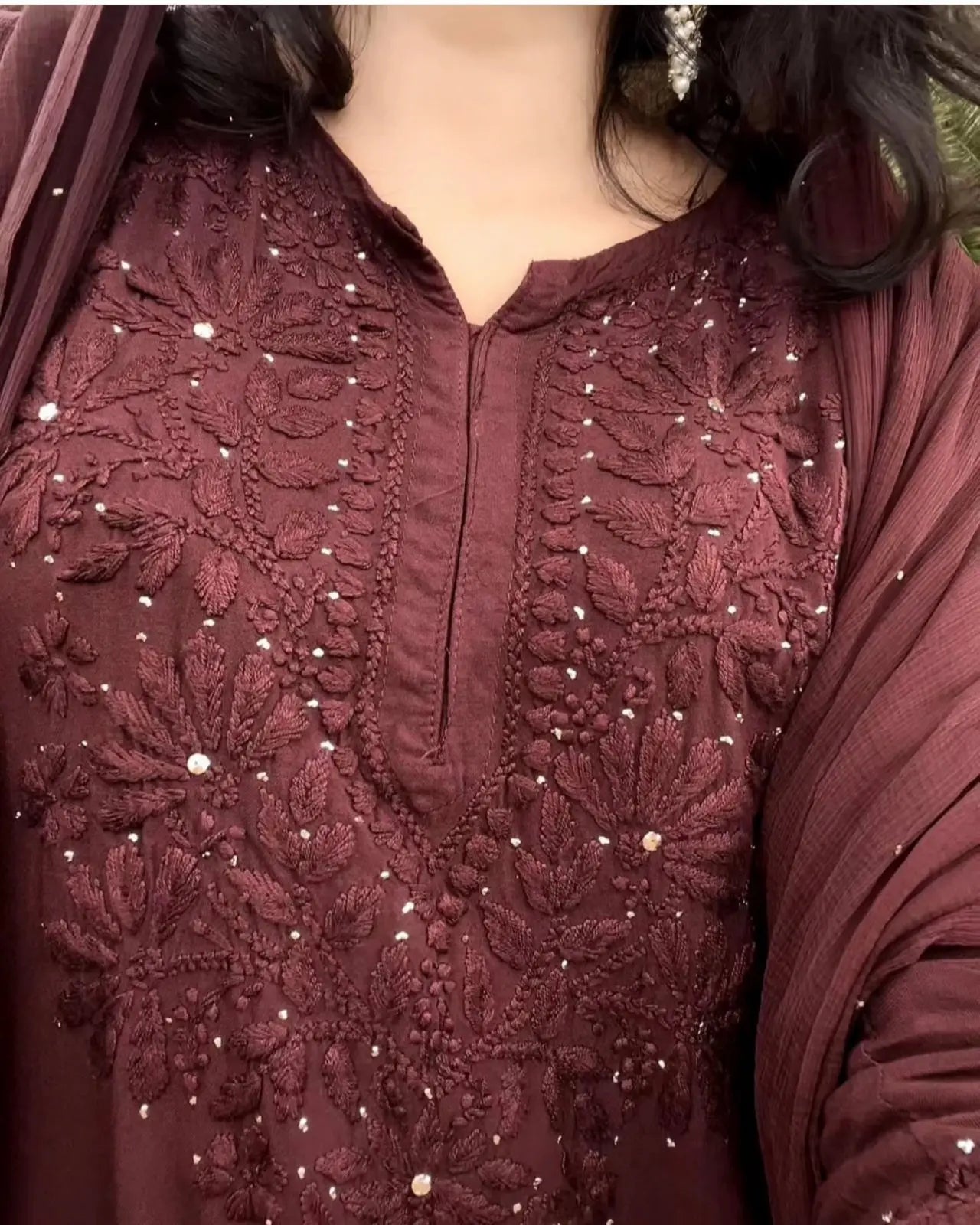 
Nagma brown rayon Lucknowi Mukesh chikankari set with dupatta featuring intricate hand embroidery and delicate Mukesh work for timeless festive and ethnic elegance by Hayat's Lucknowi.
