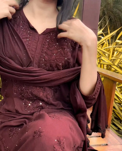 
Nagma brown rayon Lucknowi Mukesh chikankari set with dupatta featuring intricate hand embroidery and delicate Mukesh work for timeless festive and ethnic elegance by Hayat's Lucknowi.
