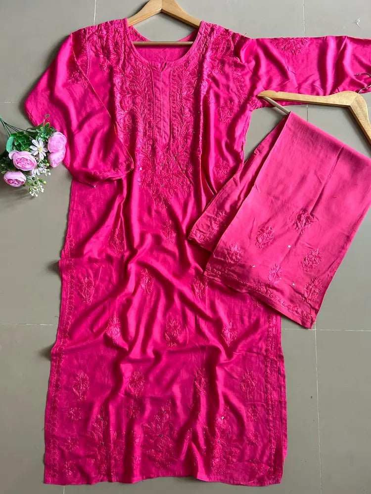 
Nagma hot pink rayon Lucknowi Mukesh chikankari set with dupatta featuring intricate hand embroidery and shimmering Mukesh work for vibrant festive and ethnic wear by Hayat's Lucknowi.
