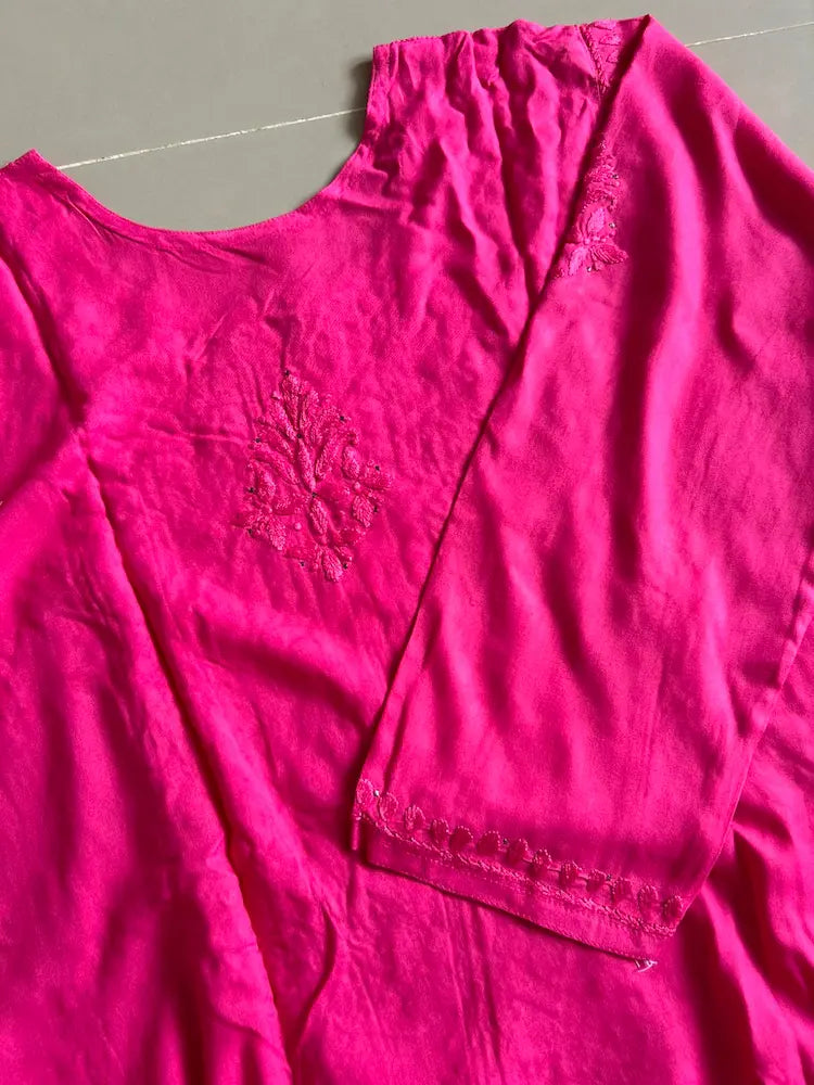 
Nagma hot pink rayon Lucknowi Mukesh chikankari set with dupatta featuring intricate hand embroidery and shimmering Mukesh work for vibrant festive and ethnic wear by Hayat's Lucknowi.
