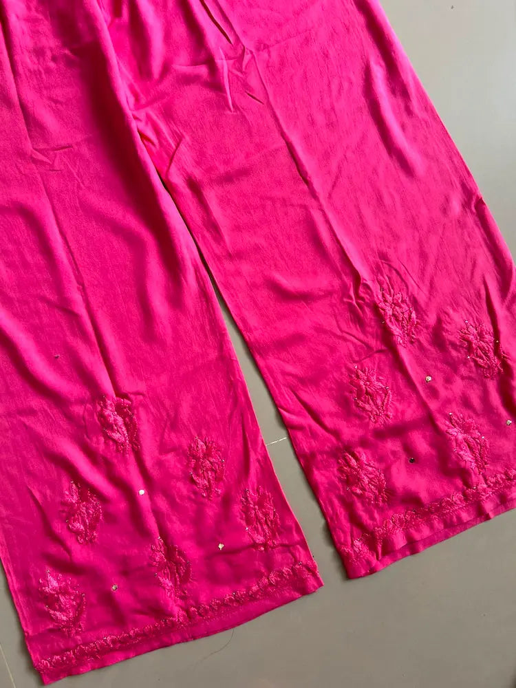 
Nagma hot pink rayon Lucknowi Mukesh chikankari set with dupatta featuring intricate hand embroidery and shimmering Mukesh work for vibrant festive and ethnic wear by Hayat's Lucknowi.
