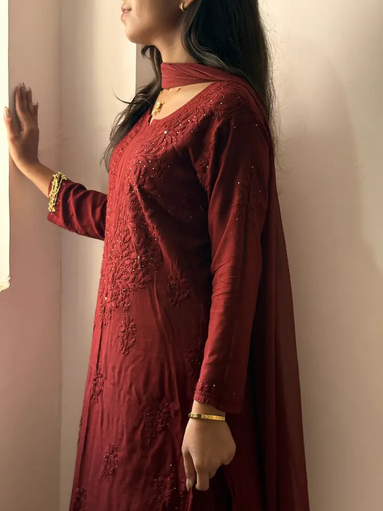 
Nagma maroon rayon Lucknowi chikankari set with dupatta featuring intricate mukesh work and elegant hand embroidery for festive ethnic wear by Hayat's Lucknowi