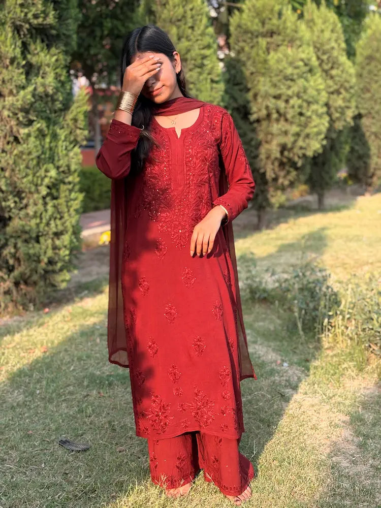 
Nagma maroon rayon Lucknowi chikankari set with dupatta featuring intricate mukesh work and elegant hand embroidery for festive ethnic wear by Hayat's Lucknowi