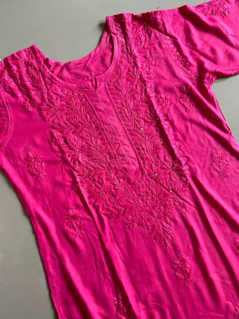 
Nagma hot pink rayon Lucknowi Mukesh chikankari set with dupatta featuring intricate hand embroidery and shimmering Mukesh work for vibrant festive and ethnic wear by Hayat's Lucknowi.
