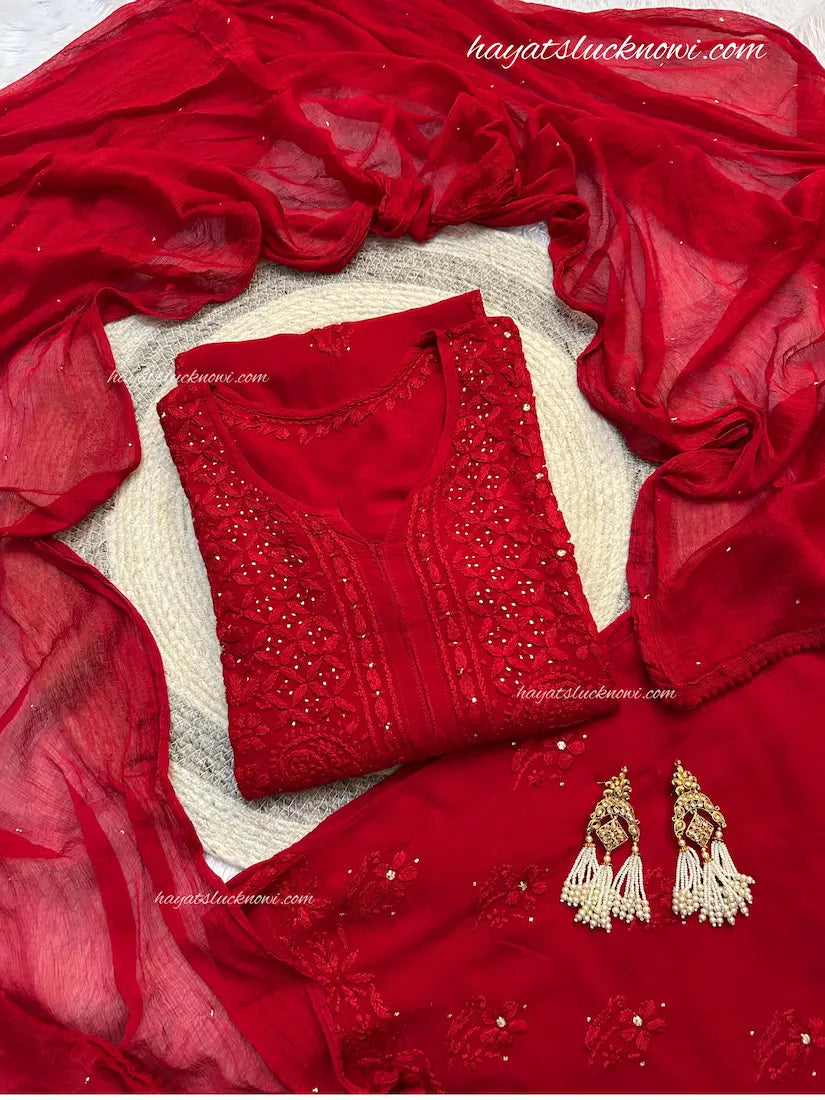 Red rayon mukesh chikankari suit set by Hayat’s Lucknowi