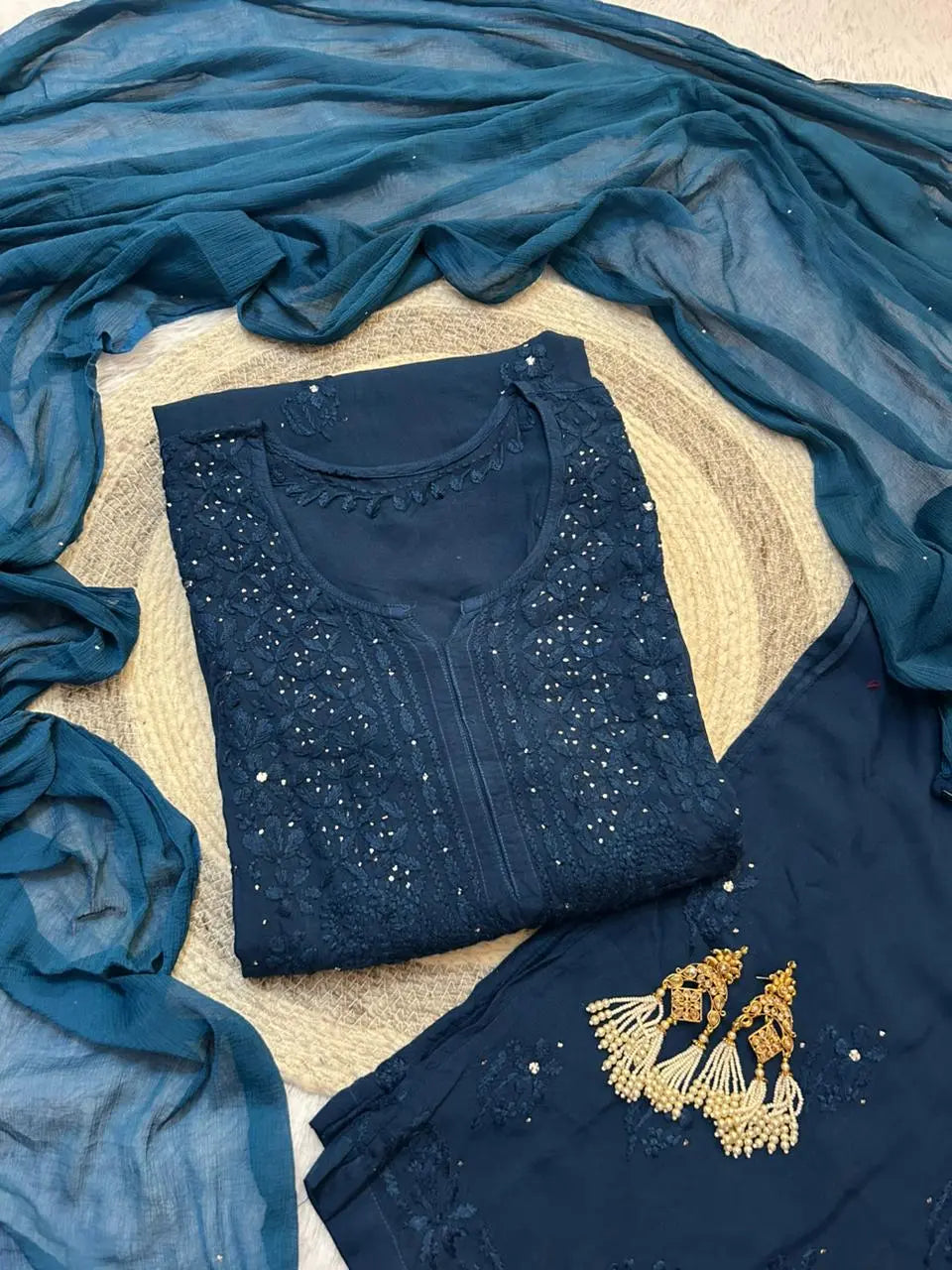 
Nagma royal blue rayon Lucknowi Mukesh chikankari set with dupatta featuring intricate hand embroidery and shimmering Mukesh work for elegant festive and ethnic wear by Hayat's Lucknowi.
