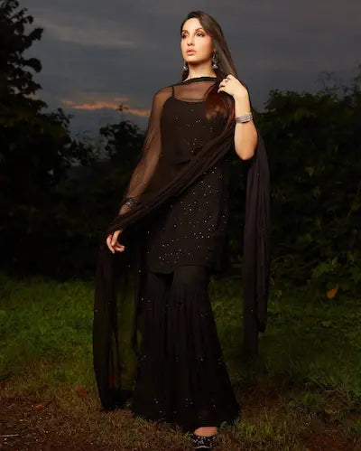 Black viscose georgette gharara set with chikankari and mukesh embroidery by Hayat’s Lucknowi