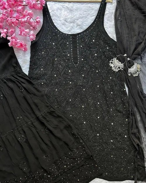 Black viscose georgette gharara set with chikankari and mukesh embroidery by Hayat Lucknowi