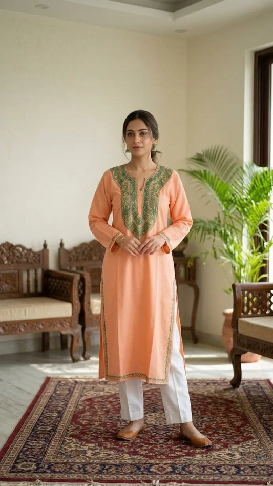 
Peach Kashmiri long kurta with chinar green embroidery showcasing traditional craftsmanship and timeless ethnic elegance by Hayat's Lucknowi