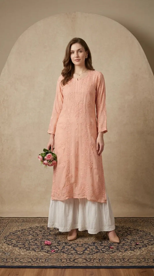 
Peach viscose georgette chikankari long kurta crafted with delicate traditional embroidery by Hayat's Lucknowi
