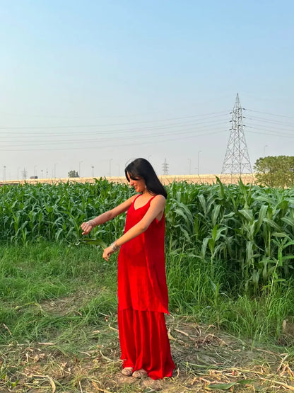 
Zareen red georgette chikankari kurta garara set featuring delicate hand embroidery and flowy lightweight fabric for elegant festive and traditional ethnic wear by Hayat's Lucknowi.
