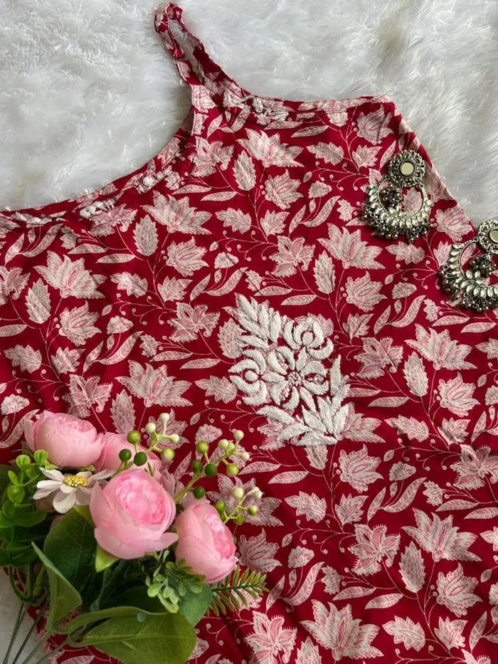 Saaz Red Noodle Strap Mul Mul Kurta featuring delicate Chikankari embroidery on lightweight, soft and breathable Mul Mul cotton fabric for an elegant and effortless ethnic look by Hayat’s Lucknowi.
