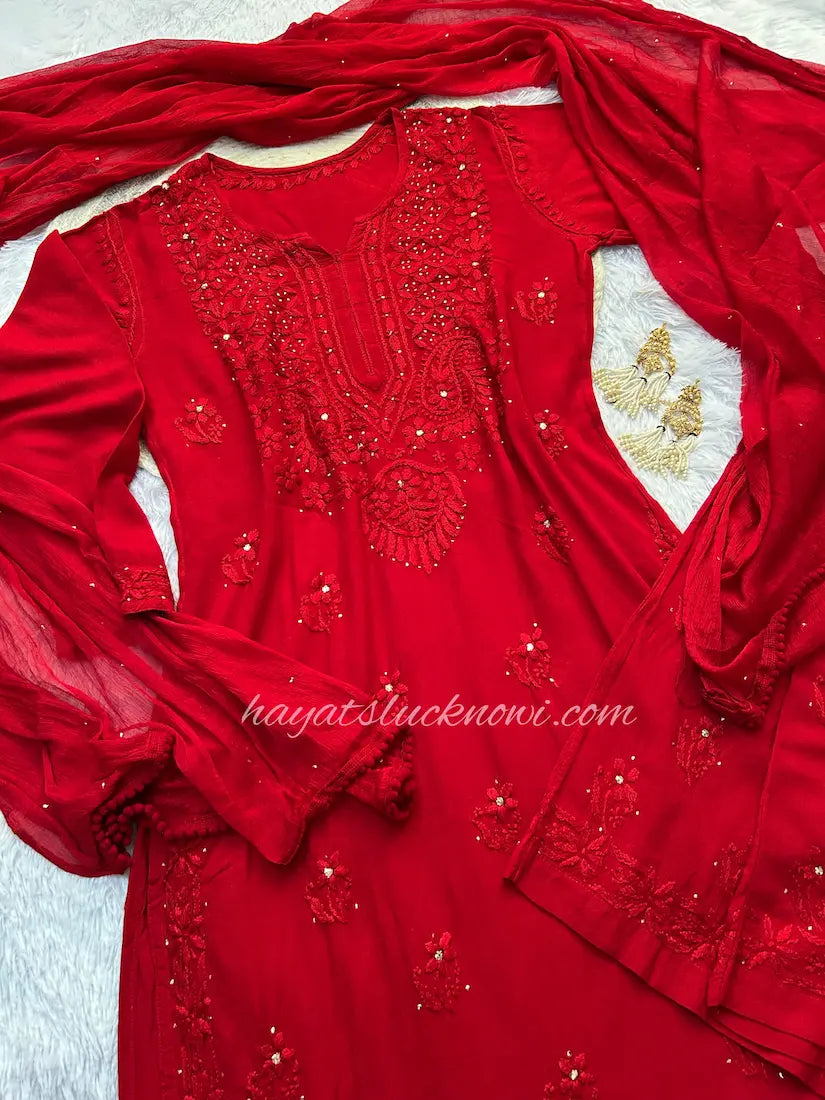 Red rayon mukesh chikankari suit set by Hayat’s Lucknowi