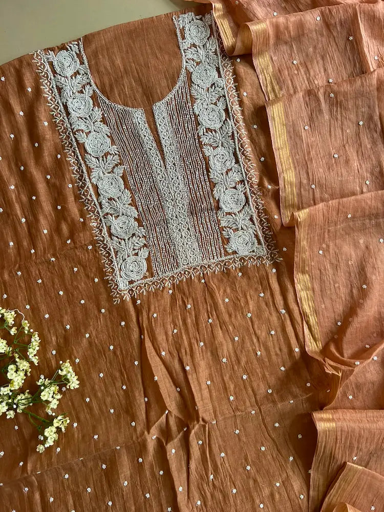 
Reshmi women's brown mul Chanderi handwork kurta and dupatta unstitched suit featuring intricate handcrafted detailing and elegant traditional craftsmanship for timeless ethnic wear by Hayat's Lucknowi.
