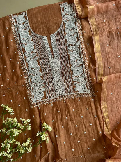 
Reshmi women's brown mul Chanderi handwork kurta and dupatta unstitched suit featuring intricate handcrafted detailing and elegant traditional craftsmanship for timeless ethnic wear by Hayat's Lucknowi.
