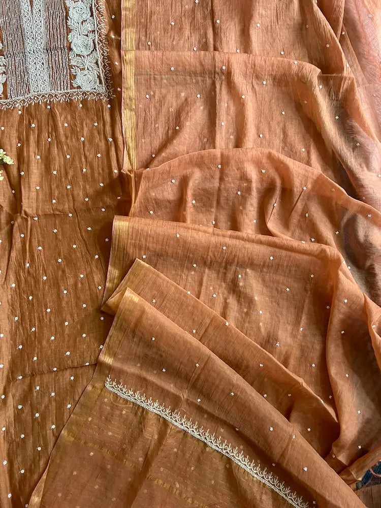 
Reshmi women's brown mul Chanderi handwork kurta and dupatta unstitched suit featuring intricate handcrafted detailing and elegant traditional craftsmanship for timeless ethnic wear by Hayat's Lucknowi.
