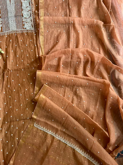 
Reshmi women's brown mul Chanderi handwork kurta and dupatta unstitched suit featuring intricate handcrafted detailing and elegant traditional craftsmanship for timeless ethnic wear by Hayat's Lucknowi.
