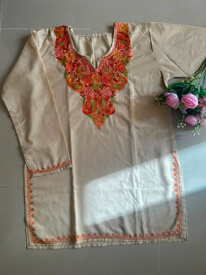 
Rida ivory cotton Kashmiri short embroidered kurti featuring intricate traditional Kashmiri embroidery and soft breathable cotton fabric for timeless everyday ethnic wear by Hayat's Lucknowi.
