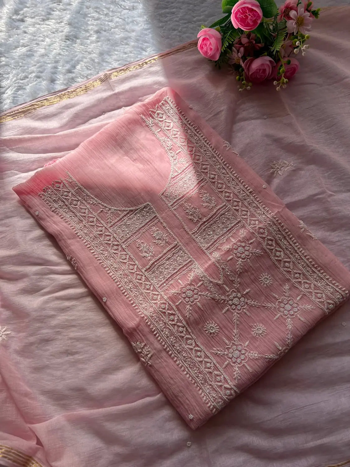
Roohi women's pink mul Chanderi handwork kurta and dupatta unstitched suit featuring intricate handcrafted detailing and elegant traditional craftsmanship for graceful ethnic wear by Hayat's Lucknowi.
