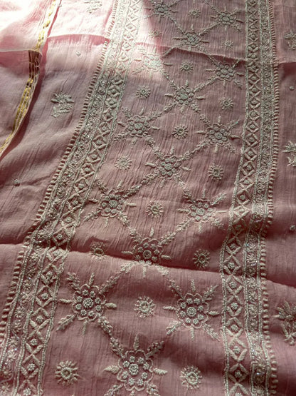 
Roohi women's pink mul Chanderi handwork kurta and dupatta unstitched suit featuring intricate handcrafted detailing and elegant traditional craftsmanship for graceful ethnic wear by Hayat's Lucknowi.
