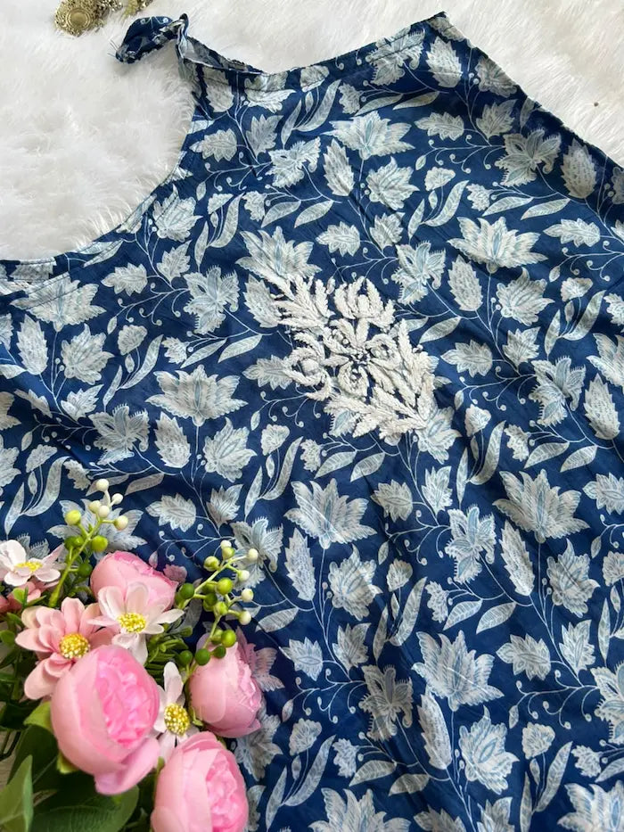 Saaz Blue Noodle Strap Mul Mul Kurta featuring delicate Chikankari embroidery on lightweight, soft and breathable Mul Mul cotton fabric for an elegant and effortless ethnic look by Hayat’s Lucknowi.
