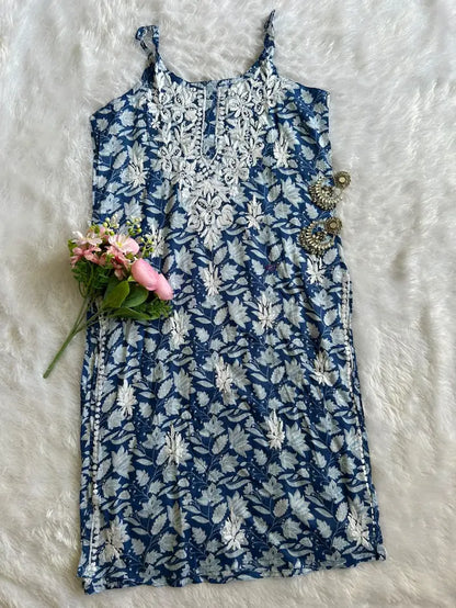 Saaz Blue Noodle Strap Mul Mul Kurta featuring delicate Chikankari embroidery on lightweight, soft and breathable Mul Mul cotton fabric for an elegant and effortless ethnic look by Hayat’s Lucknowi.
