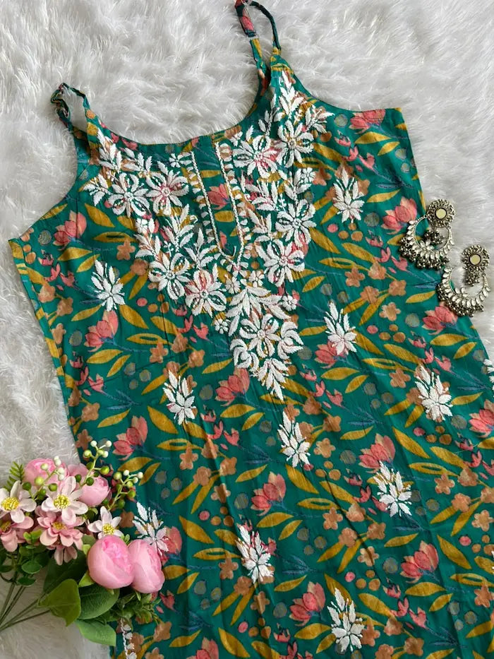 Saaz Green Noodle Strap Mul Mul Kurta featuring delicate Chikankari embroidery on lightweight, soft and breathable Mul Mul cotton fabric for an elegant and effortless ethnic look by Hayat’s Lucknowi.
