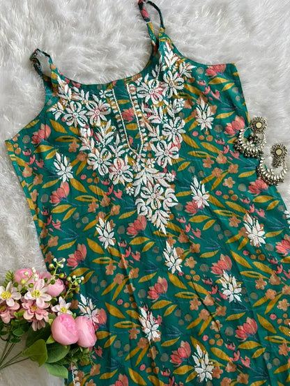Saaz Green Noodle Strap Mul Mul Kurta featuring delicate Chikankari embroidery on lightweight, soft and breathable Mul Mul cotton fabric for an elegant and effortless ethnic look by Hayat’s Lucknowi.
