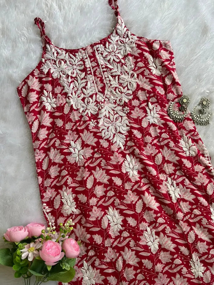 Saaz Red Noodle Strap Mul Mul Kurta featuring delicate Chikankari embroidery on lightweight, soft and breathable Mul Mul cotton fabric for an elegant and effortless ethnic look by Hayat’s Lucknowi.
