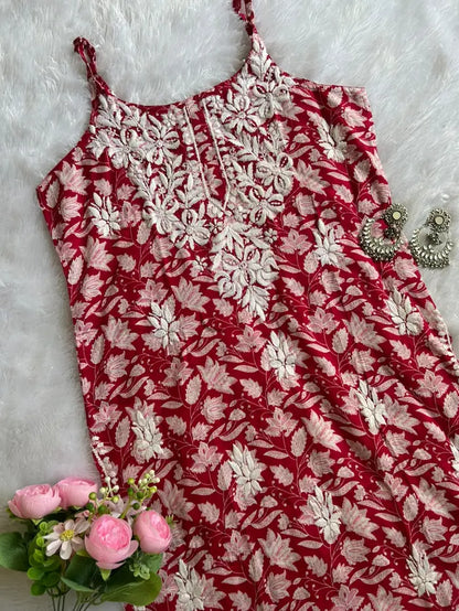 Saaz Red Noodle Strap Mul Mul Kurta featuring delicate Chikankari embroidery on lightweight, soft and breathable Mul Mul cotton fabric for an elegant and effortless ethnic look by Hayat’s Lucknowi.
