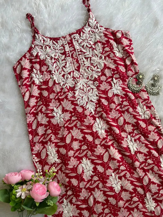 Saaz Red Noodle Strap Mul Mul Kurta featuring delicate Chikankari embroidery on lightweight, soft and breathable Mul Mul cotton fabric for an elegant and effortless ethnic look by Hayat’s Lucknowi.
