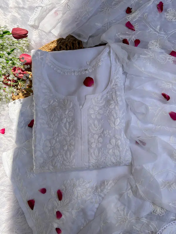 White suit set with chikankari embroidery by Hayat’s Lucknowi