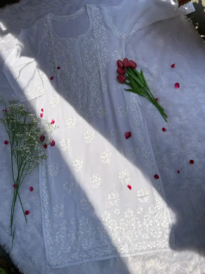 White suit set with chikankari embroidery by Hayat’s Lucknowi