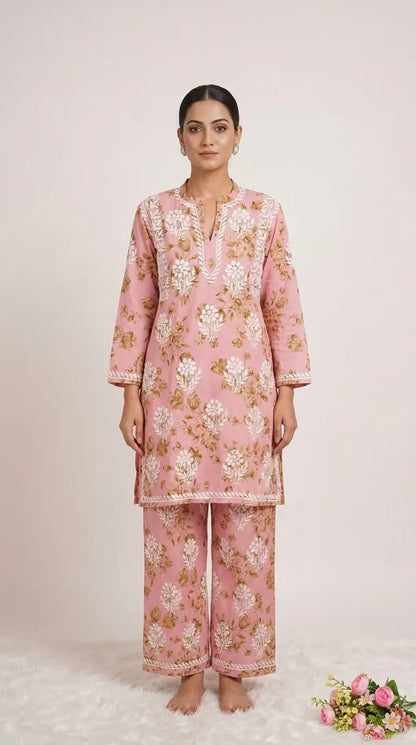 
Sana pink mul mul Lucknowi chikankari kurta set featuring delicate hand embroidery and soft breathable fabric for graceful everyday and festive ethnic wear by Hayat's Lucknowi.
